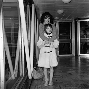 Joan Collins at Heathrow Airport with her daughter Katyana after a holiday in the Bahamas