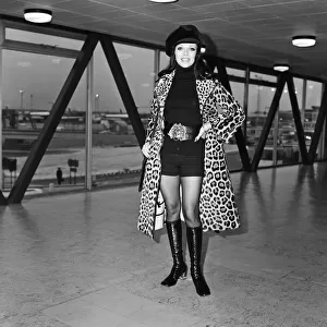 Joan Collins at Heathrow Airport today, she is going to Rome for a holiday
