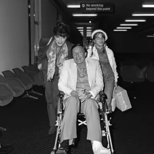 Joan Collins with Family at Heathrow 1982 Print