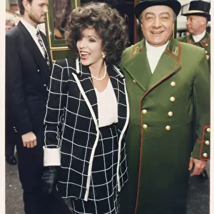 JOAN COLLINS AND MOHAMMED AL FAYED OUTSIDE HARRODS 22 / 07 / 1999