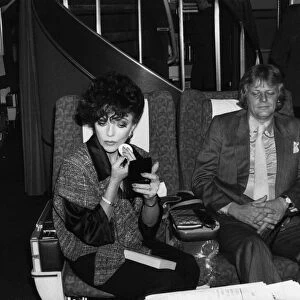 Joan Collins and Peter Holm in March 1985