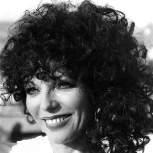 Joan Collins posing on quayside at Cannes film festival - May 1979