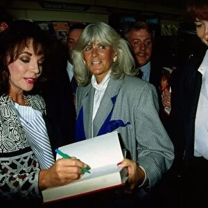 Joan Collins signing book for Nancy Smith June 1989