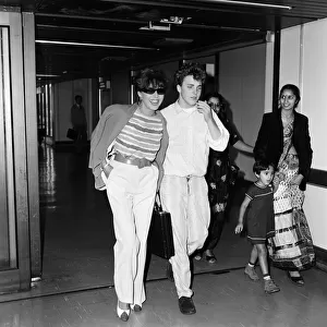 Joan Collins with her son Sacha, 17, arriving at Heathrow from Los Angeles