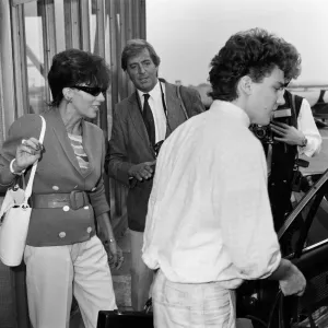 Joan Collins with her son Sacha, 17, arriving at Heathrow from Los Angeles Joan Collins with her son Sacha, 17, arriving at Heathrow from Los Angeles