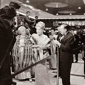 Joan Crawford at the Premier of My Fair Lady film in New York laughing