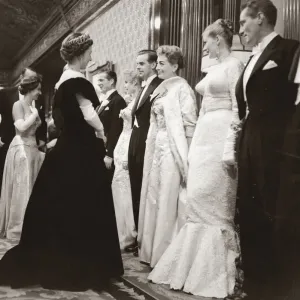 Joan Crawford at the Royal Film Show, talking to the Queen of England smiling Joan Crawford at the Royal Film Show, talking to the Queen of England smiling