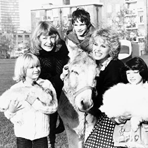 Joanna Lumley acterss with Sue Cook during an appeal for Children In Need