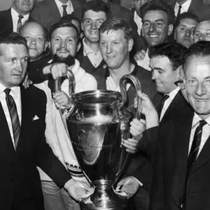 Jock Stein proudly shows off the European Cup to Scottish referees at the Middleton