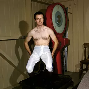 Jockey Jonjo O Neill sitting on a weighing machine, March 1985