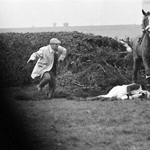 Jockey Paddy Farrell is thrown from his horse Border Flight at the 15th fence of