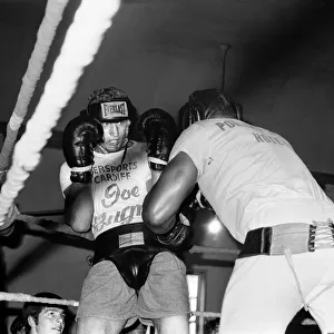 Joe Bugner (left) sparring at a gymnasium in West 28th Street, New York City
