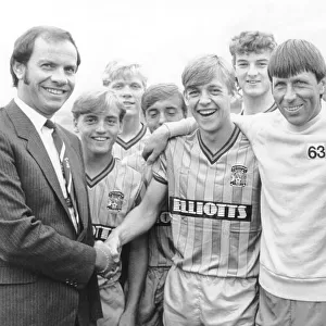 Joe Elliott shakes on a shirt sponsorship deal for Coventry City