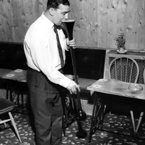 Joe Goodluck starts on a yard of ale at his local pub October 1964