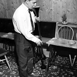 Joe Goodluck starts on a yard of ale at his local pub October 1964