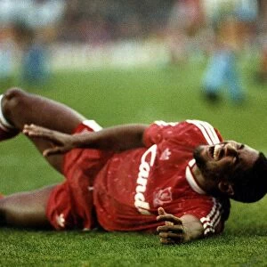 John Barnes Liverpool footballer collapses after he falls in pain from a hamstring injury