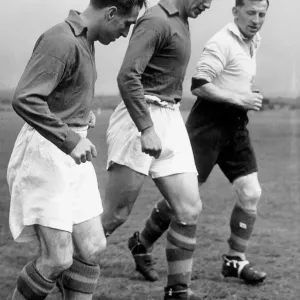 John Charles centre of Leeds United training with two colleagues, 1954