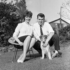 John Connelly, Burnley FC, pictured at home with wife Sandra & pet dog after being