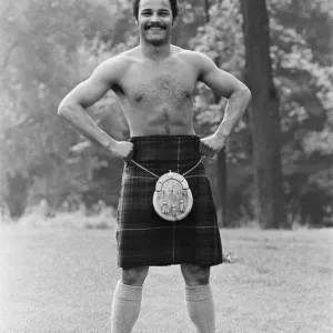 John Conteh gets the Scottish flavour on Parliament Hill Fields today watched by curious John Conteh gets the Scottish flavour on Parliament Hill Fields today watched by curious