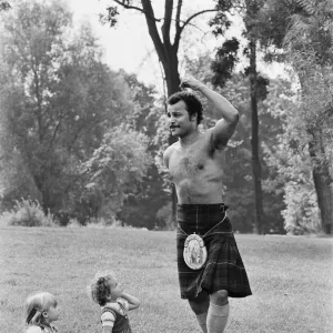 John Conteh gets the Scottish flavour on Parliament Hill Fields today watched by curious John Conteh gets the Scottish flavour on Parliament Hill Fields today watched by curious