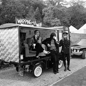 John Entwistle and Keith Moon of the rock group The Who show off their new cars at