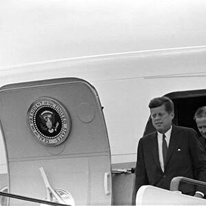 John F. Kennedy on the stairs leading from Airforce One during a visits to Eire in