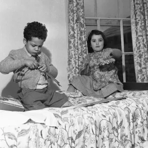 John Johnson (left) aged five plays with his train set with Elizabeth Milland in John Johnson (left) aged five plays with his train set with Elizabeth Milland in