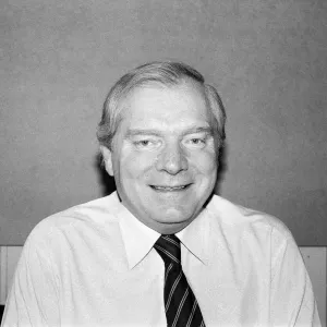 Black and white print of a man in his 30s with a suit and tie