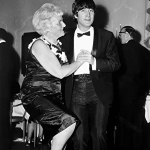 John Lennon dancing with Mrs Louise Harrison mother of George Harrison at the Dorchester