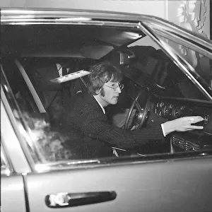 John Lennon sits at the wheel of the new Iso Rivolta S4 at the London Motor Show