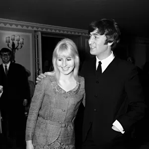 John Lennon with wife Cynthia attending a Foyles luncheon in order to launch his