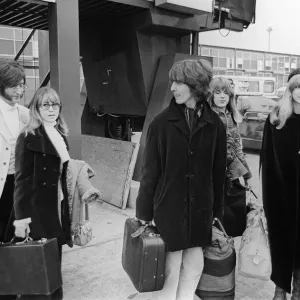 John Lennon with wife Cynthia and George Harrison and his wife Patti Boyd at Heathrow