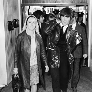 John Lennon with wife Cynthia Lennon leaving the Pam American (Pan Am