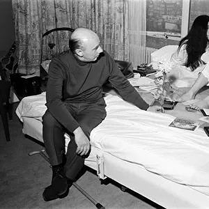 John Lennon and his wife Yoko Ono stage a bed in on their honeymoon