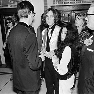 John Lennon and Yoko Ono on their first public appearance together at London
