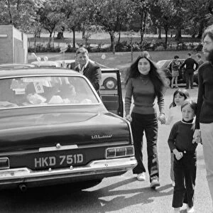John Lennon and Yoko Ono greeting fans near their home in Surrey before a trip up to