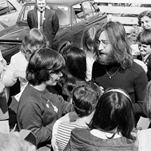 John Lennon and Yoko Ono greeting fans before a trip up to Durness