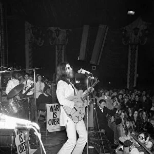 John Lennon and Yoko Ono on stage at the Lyceum. John was playing live for