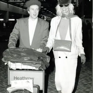 John Lydon and Nora Leaving Heathrow for Sex Pistols Tour Print 1988 John Lydon and Nora Leaving Heathrow for Sex Pistols Tour Print 1988
