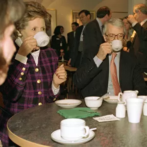 John Major Prime Minister and his wife Norma Major drink cups of tea in unison in a