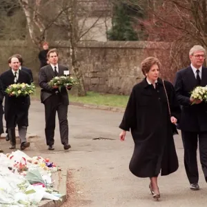John Major Prime Minister and his wife Norma walking with wreath at Dunblane Primary