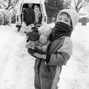 John Martin aged 3, collects supplies from the mobile shop outside his home in Potto John Martin aged 3, collects supplies from the mobile shop outside his home in Potto