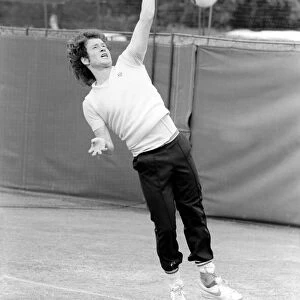 John McEnroe, with a foot bandaged and leather support seen here during training running