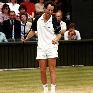 John McEnroe tennis champion in action angry with himself