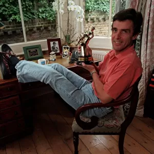 John Satpleton TV Presenter September 1998 At home sitting on his desk