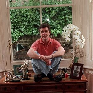 John Stapleton TV Presenter September 1998 At home sitting on his desk
