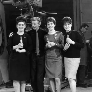 Black and white print of Johnnie Stewart with three girls in a TV studio Black and white print of Johnnie Stewart with three girls in a TV studio