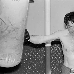 Johnny Frankham Boxer May 1975 hitting punchbag in his training gym traing for his next