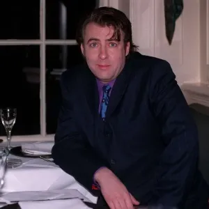 Jonathan Ross TV Presenter December 1997 Siting at table A©mirrorpix Jonathan Ross TV Presenter December 1997 Siting at table A©mirrorpix