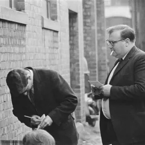 Journalists take notes as Beatles fans queue for tickets in Newcastle Upon Tyne Journalists take notes as Beatles fans queue for tickets in Newcastle Upon Tyne
